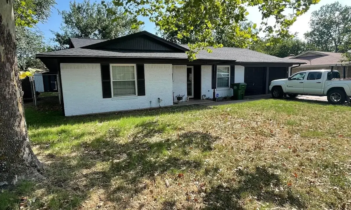 Professional roofing crew working on a residential roof in Flagstaff